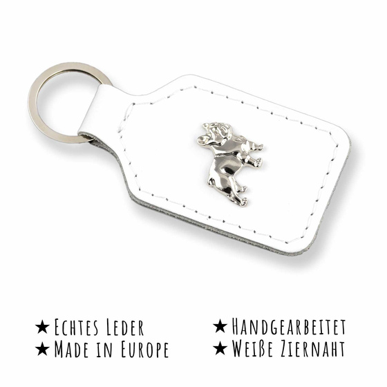 Das Bild mit Beschreibung zeigt ein Franzsische Bulldogge Hund aus weiem Leder mit Ziernaht